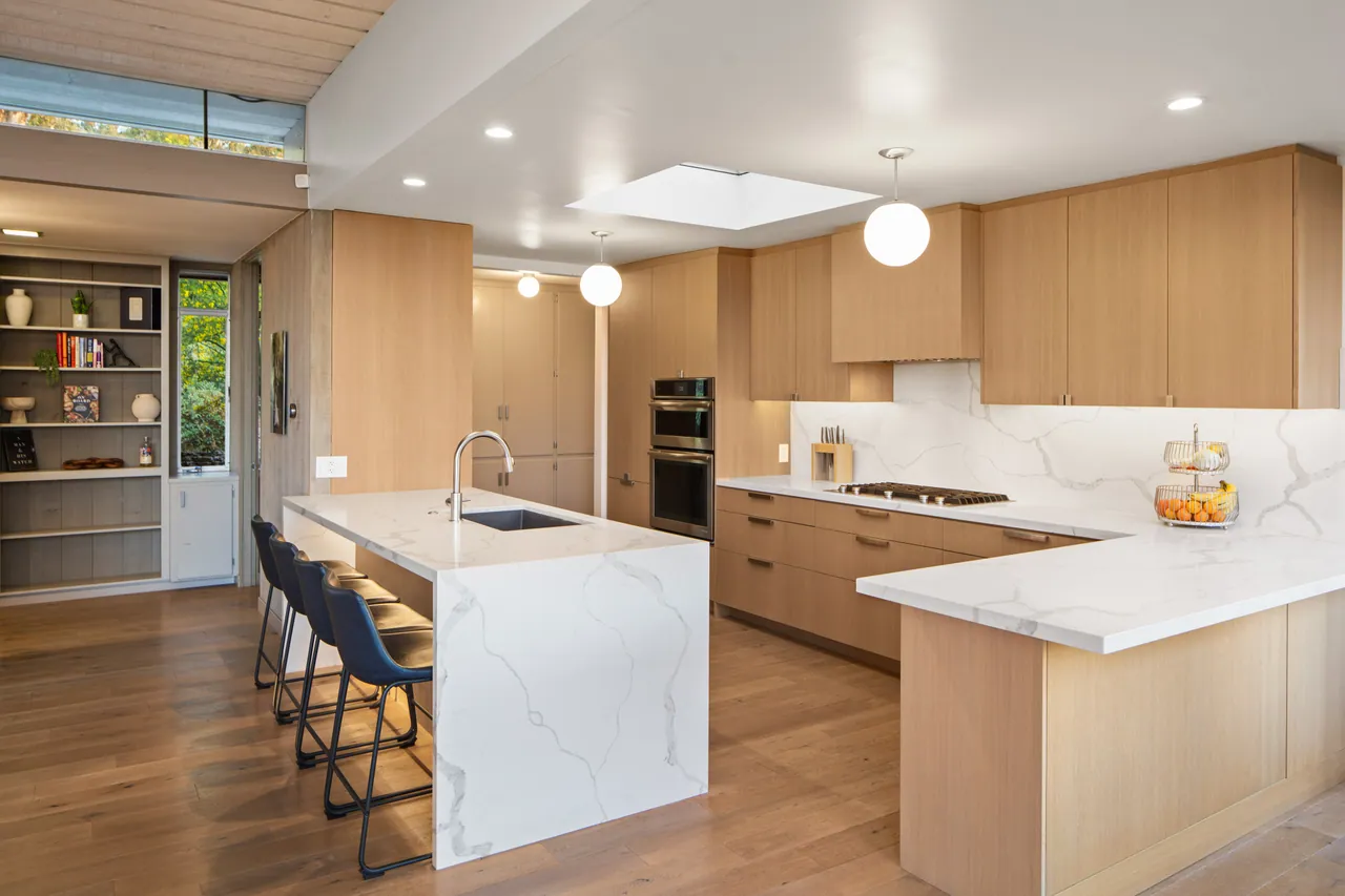 Kitchen island with a waterfall stone counter