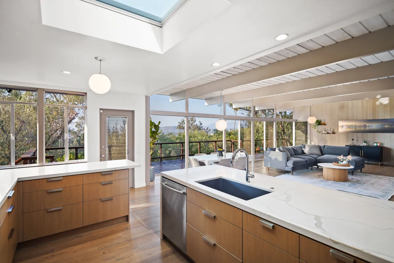 Kitchen sink and island looking out to the great room