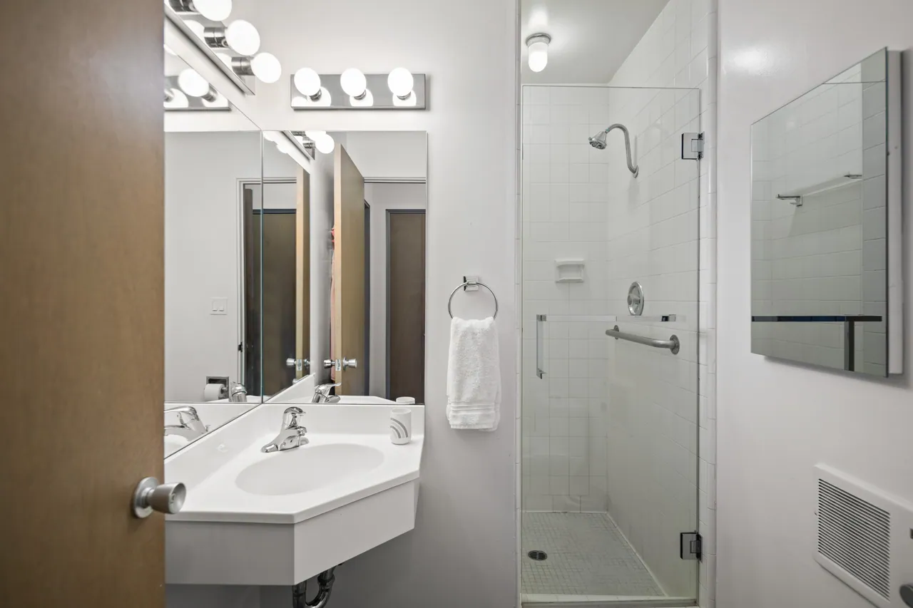 Second bath with a glass-enclosed shower