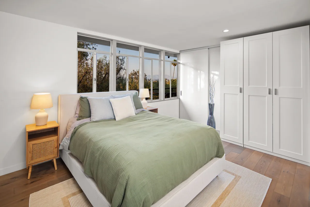 Bedroom 3 with ribbon windows and a built-in wardrobe