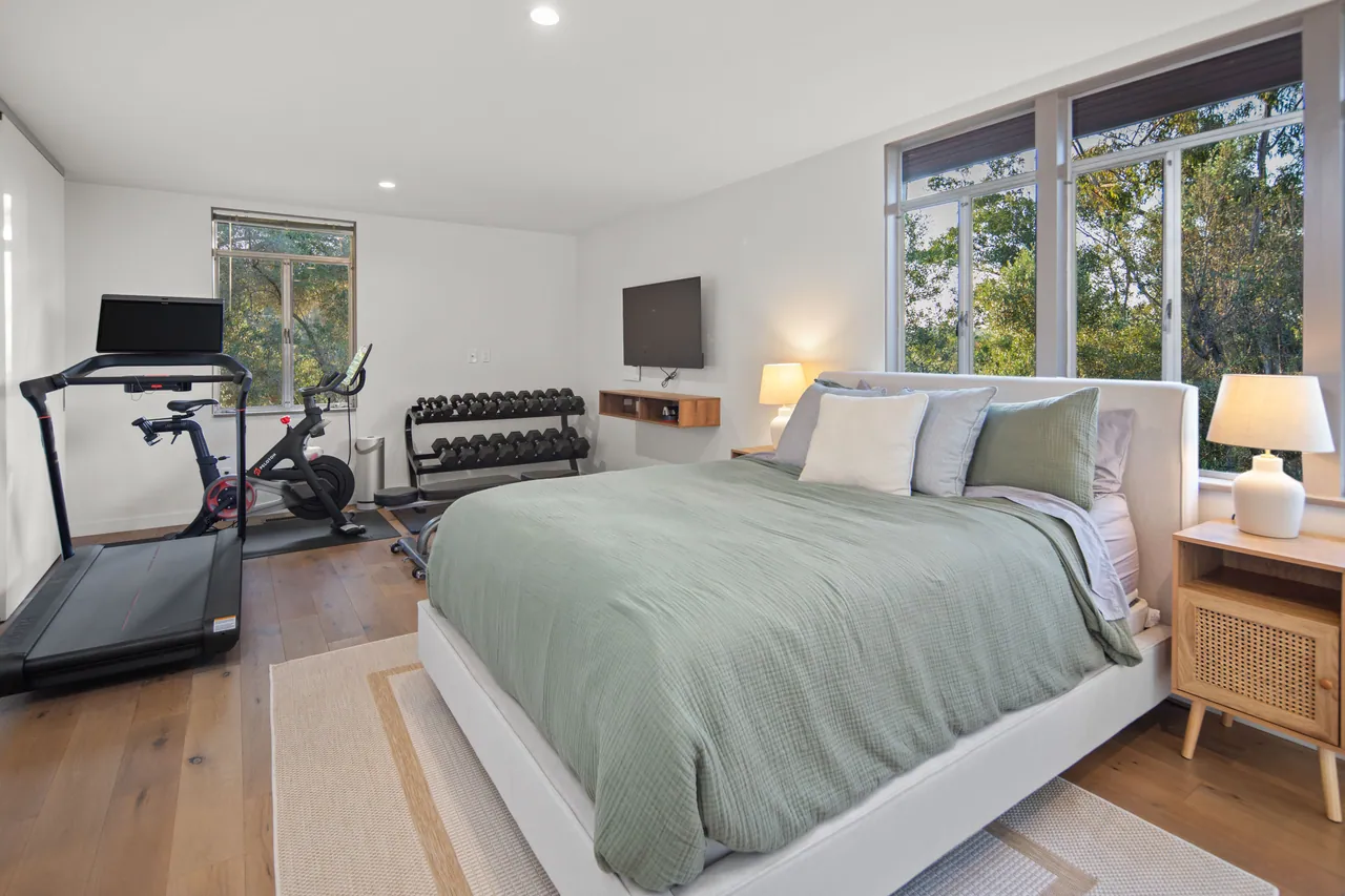 Bedroom 3, a large room with windows on two sides