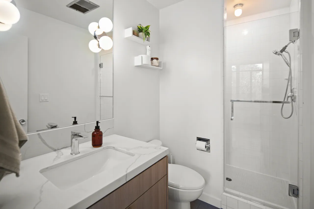 Bedroom 3 bath with walk-in shower and stone vanity